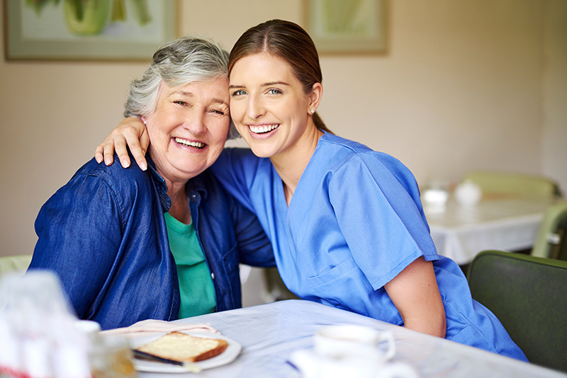 Smiling patient and nurse
