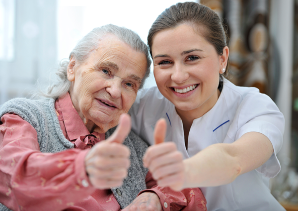 Patient and nurse giving thumbs up