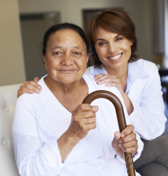 Smiling patient with cane